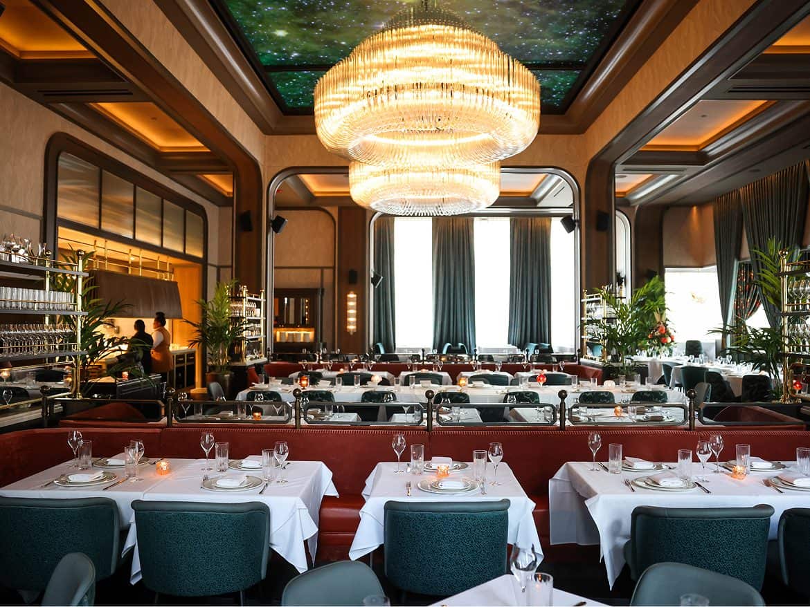 Upscale restaurant dining area with elegant decor and ambient lighting.